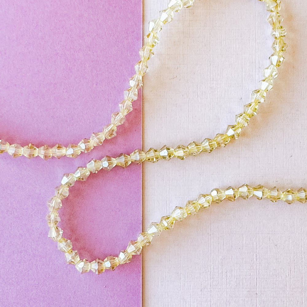 3mm Golden Clear Faceted Crystal Bicone Strand