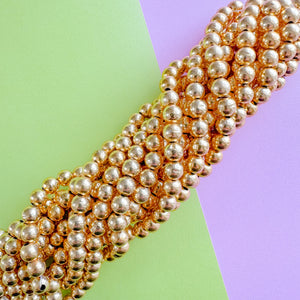 7mm Shiny Gold Textured Round Strand