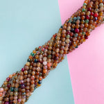 6mm Tiki Punch Agate Faceted Round Strand