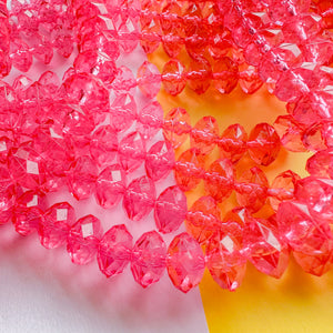 12mm Bright Pink Resin Faceted Rondelle Strand