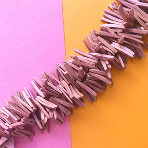 25mm Mauve Wood Spikes Strand - Beads, Inc.