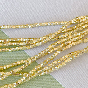 2mm Gold Faceted Nugget Strand