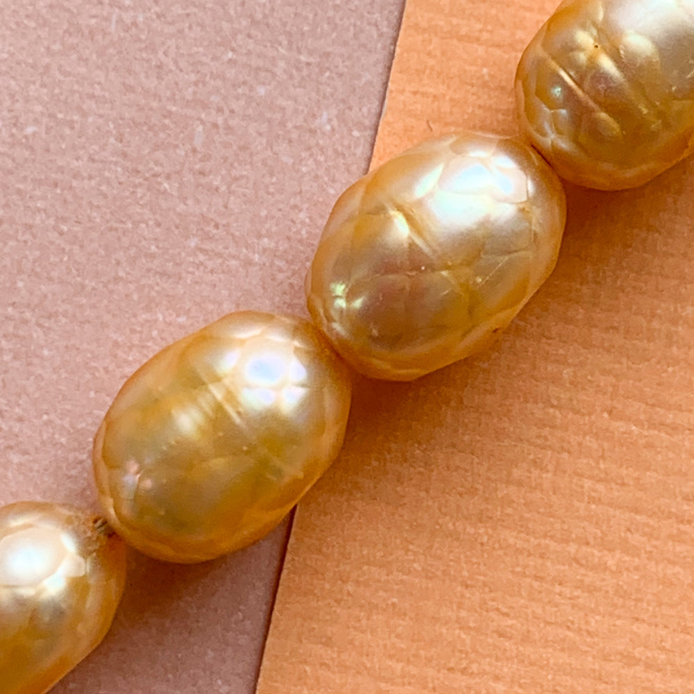 7mm Faceted Tangerine Freshwater Rice Pearl Strand