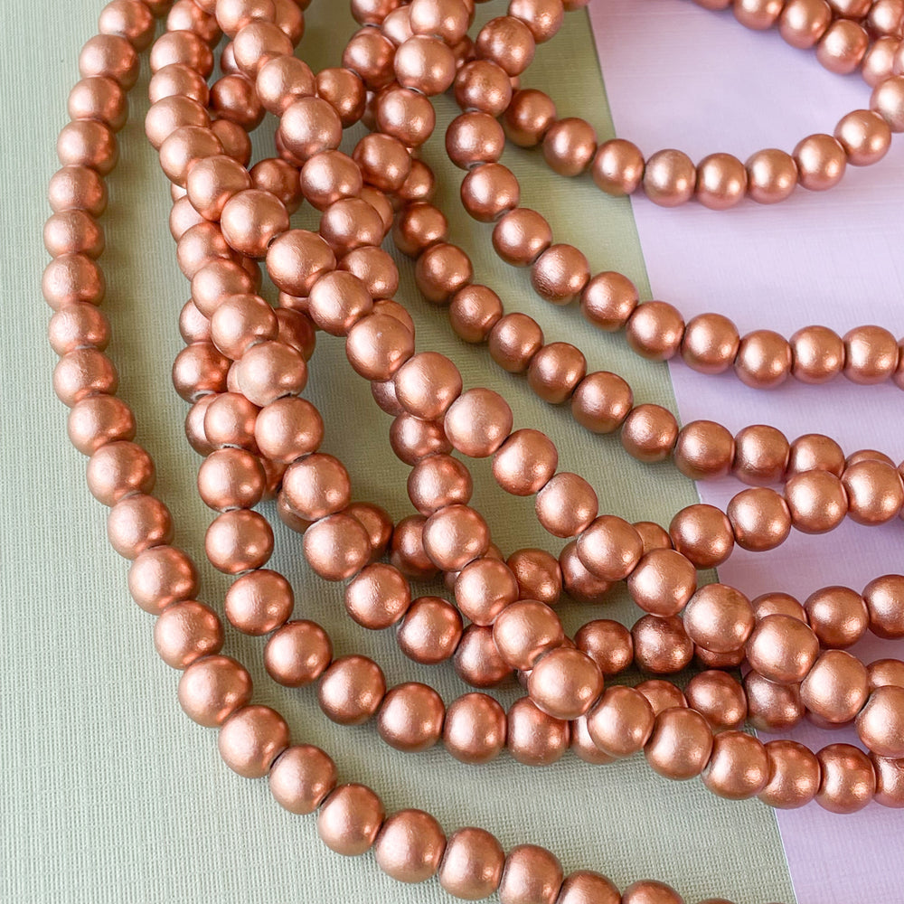 8mm Rose Gold Wood Rounds Strand