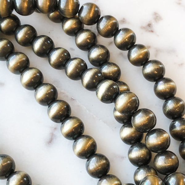 8mm Metallic Gold Navajo Rounds Strand - Christine White Style