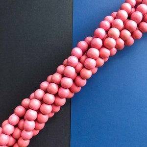 10mm Pink Wood Rounds Strand - Beads, Inc.